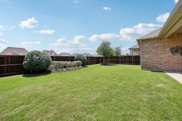 view of yard with a fenced backyard