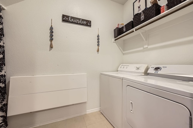 7520 Gangway Dr, Fort Worth, TX 76179 - laundry room with independent washer and dryer, light tile patterned flooring, laundry area, and baseboards