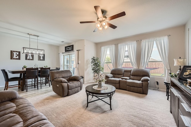 7520 Gangway Dr, Fort Worth, TX 76179 - living area featuring ceiling fan, light colored carpet, and baseboards