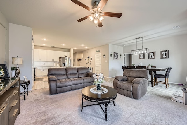 7520 Gangway Dr, Fort Worth, TX 76179 - living area featuring light colored carpet, a ceiling fan, baseboards, recessed lighting, and visible vents