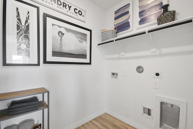 laundry room with laundry area, light wood-style floors, hookup for a washing machine, baseboards, and hookup for an electric dryer