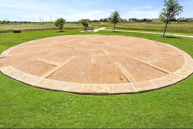 view of basketball court featuring a yard
