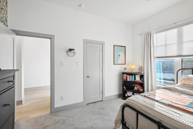 8613 Keeneland Dr, Fort Worth, TX 76120 - bedroom with baseboards and light colored carpet