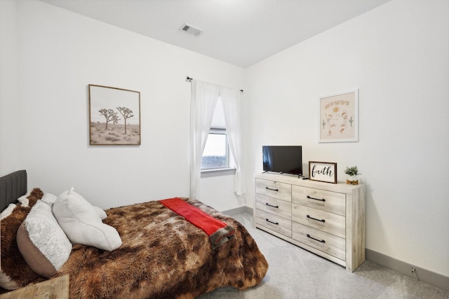 8613 Keeneland Dr, Fort Worth, TX 76120 - bedroom with light colored carpet, baseboards, and visible vents