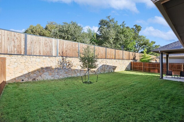 8613 Keeneland Dr, Fort Worth, TX 76120 - view of yard with a patio and a fenced backyard