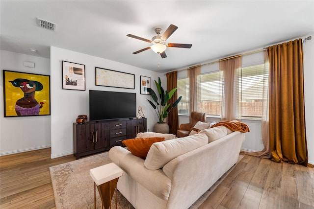 859 Sitwell Dr, Fate, TX 75087 - living area featuring baseboards, a ceiling fan, light wood-style flooring, and visible vents