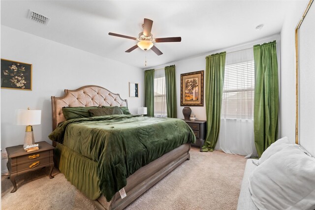 859 Sitwell Dr, Fate, TX 75087 - bedroom featuring ceiling fan, light carpet, and visible vents