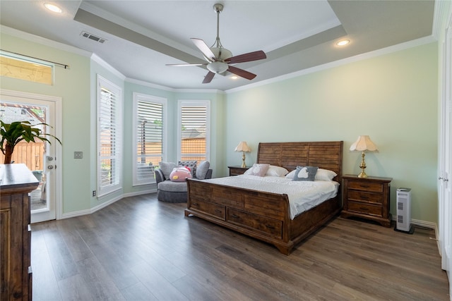 bedroom with a raised ceiling, access to exterior, recessed lighting, visible vents, and dark wood-style floors
