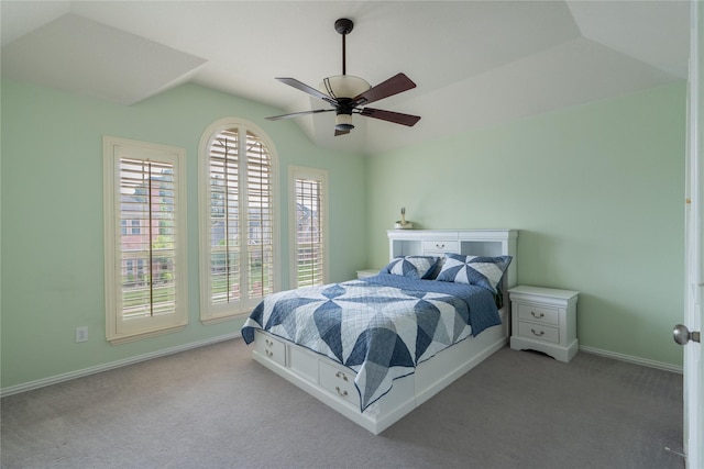 bedroom with vaulted ceiling, baseboards, ceiling fan, and carpet flooring