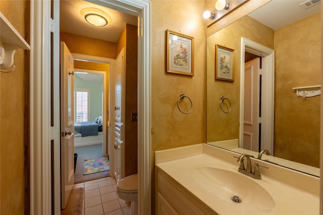 ensuite bathroom featuring visible vents, vanity, toilet, connected bathroom, and tile patterned floors