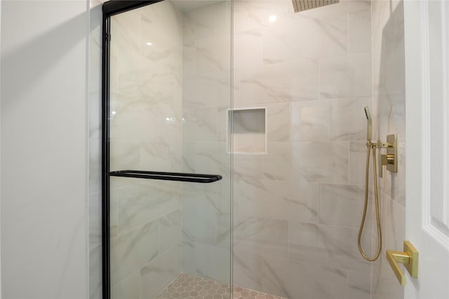 bathroom featuring a shower stall