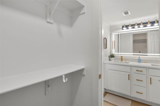 bathroom featuring vanity and visible vents