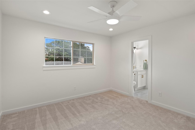 unfurnished bedroom featuring recessed lighting, baseboards, and light colored carpet