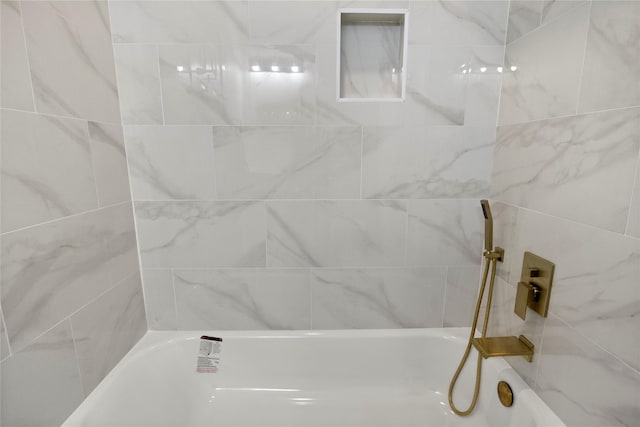 full bath featuring a tub and walk in shower