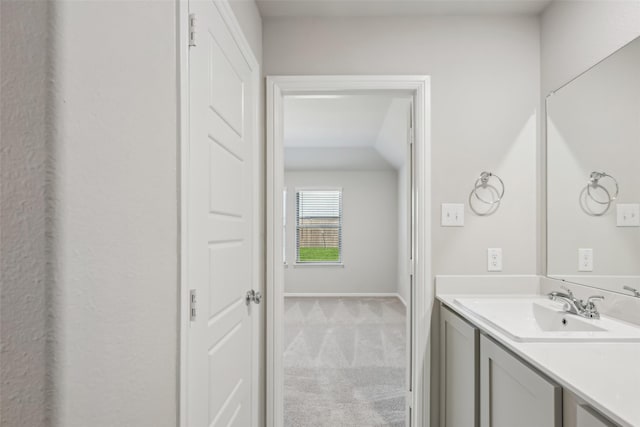 bathroom with baseboards and vanity