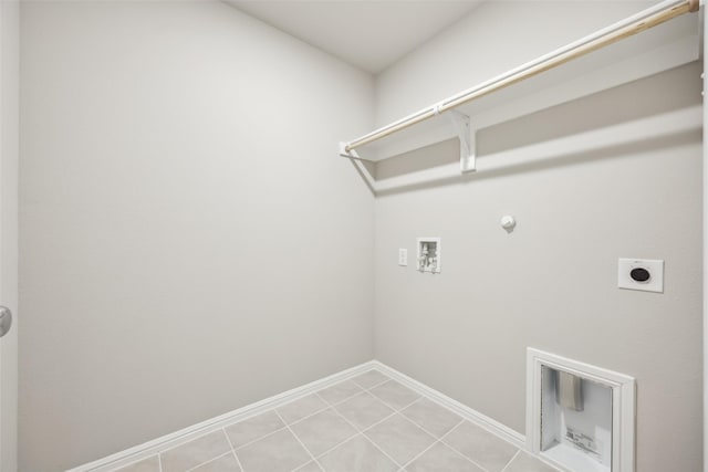 clothes washing area with laundry area, baseboards, hookup for a washing machine, electric dryer hookup, and hookup for a gas dryer