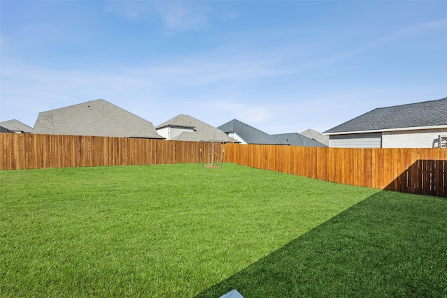 view of yard with a fenced backyard