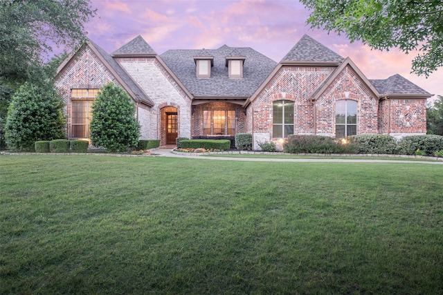 816 Stratton Mill Dr, Lucas, TX 75002 - french country inspired facade featuring a shingled roof, a front yard, and brick siding