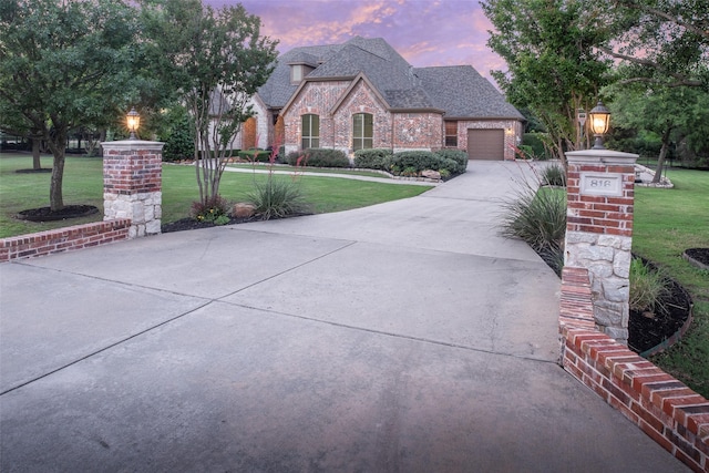 816 Stratton Mill Dr, Lucas, TX 75002 - french provincial home featuring a garage, a front yard, brick siding, a shingled roof, and driveway