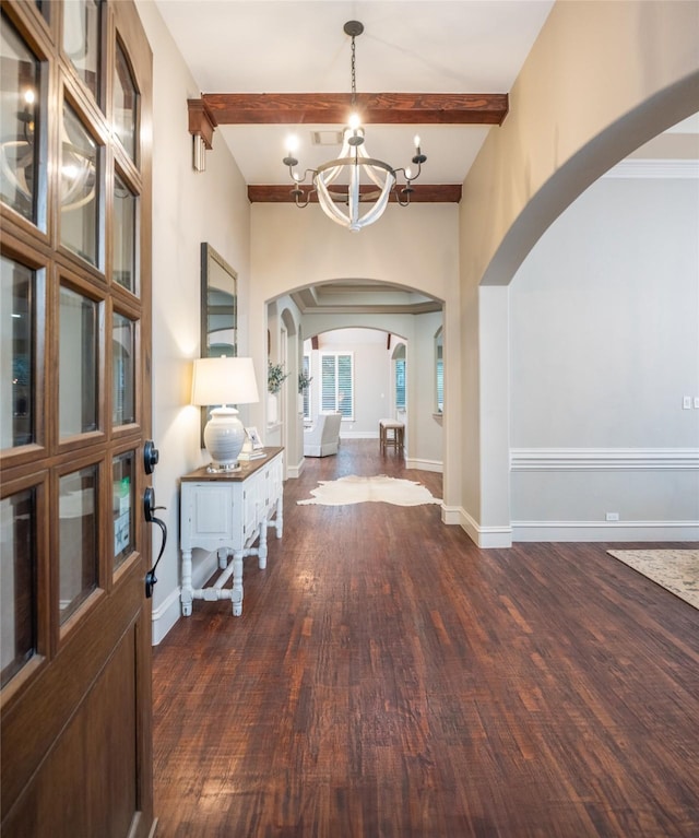 816 Stratton Mill Dr, Lucas, TX 75002 - entryway with arched walkways, wood finished floors, baseboards, beamed ceiling, and a notable chandelier