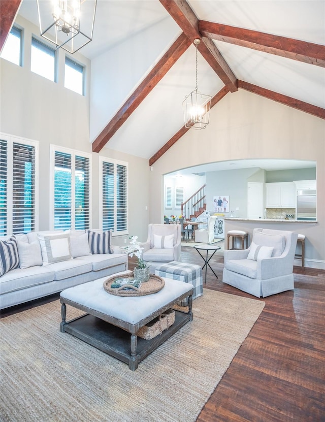 816 Stratton Mill Dr, Lucas, TX 75002 - living area featuring arched walkways, high vaulted ceiling, a chandelier, wood finished floors, and stairway