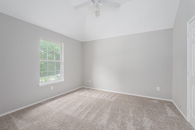unfurnished room with carpet floors, ceiling fan, baseboards, and lofted ceiling