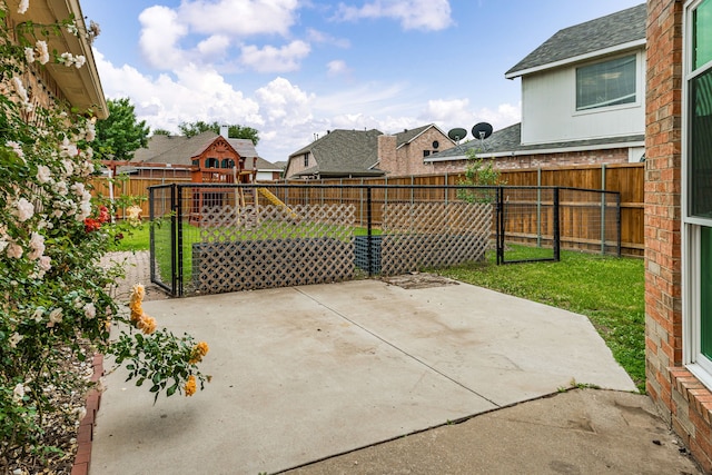 view of patio / terrace featuring a fenced backyard and a residential view