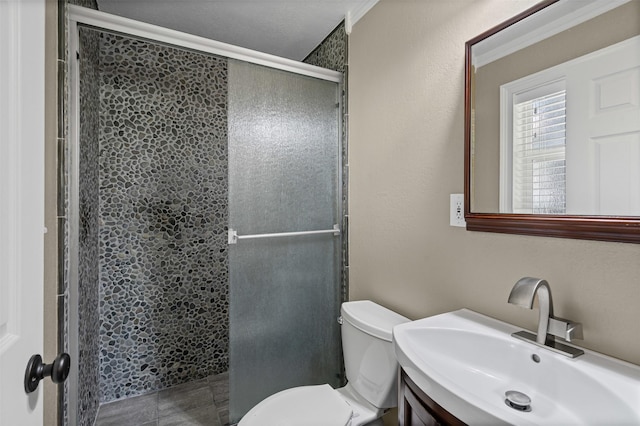 2311 Cedar Cir, Granbury, TX 76048 - bathroom featuring toilet, a stall shower, and vanity