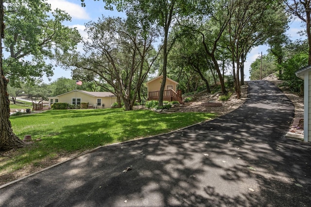 2311 Cedar Cir, Granbury, TX 76048 - view of asphalt driveway