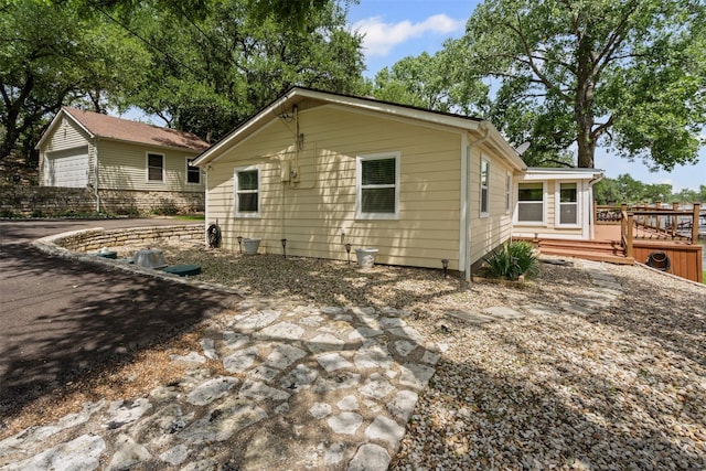 2311 Cedar Cir, Granbury, TX 76048 - back of house with a wooden deck