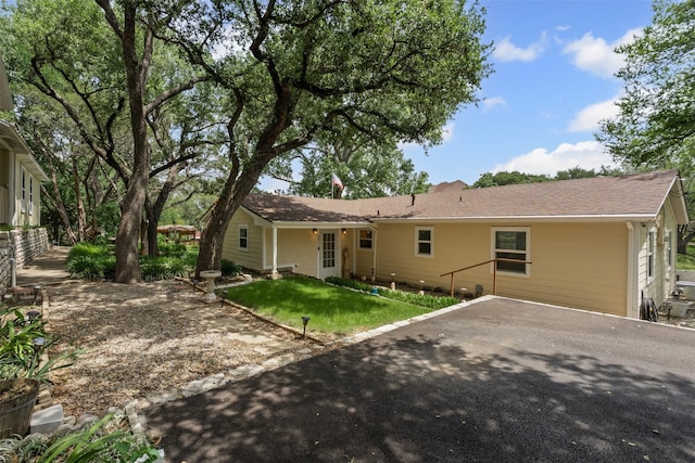 2311 Cedar Cir, Granbury, TX 76048 - back of house with a yard and driveway