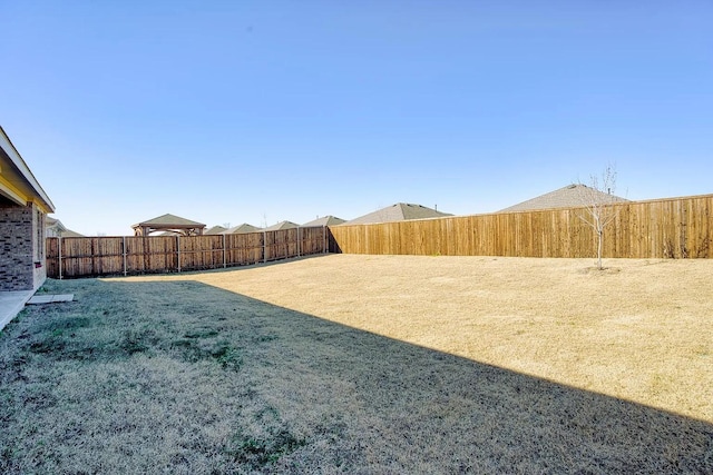 view of yard featuring a fenced backyard