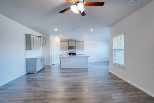 kitchen with gray cabinets, a ceiling fan, visible vents, appliances with stainless steel finishes, and recessed lighting
