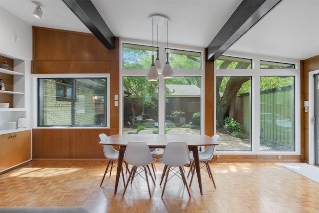 sunroom / solarium with beamed ceiling
