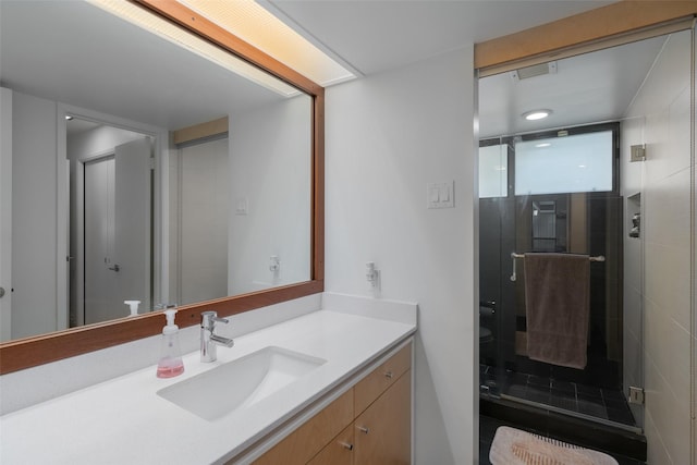 full bathroom with vanity and a stall shower