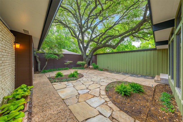 view of yard with a patio and a fenced backyard