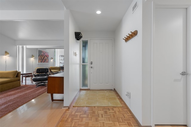 entrance foyer with visible vents, recessed lighting, and baseboards