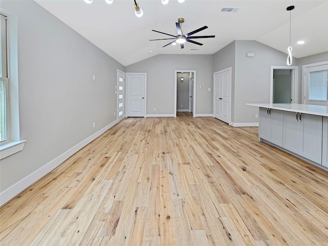 8622 Eden Valley Ln, Dallas, TX 75217 - unfurnished living room with vaulted ceiling, ceiling fan, light wood-style floors, and baseboards