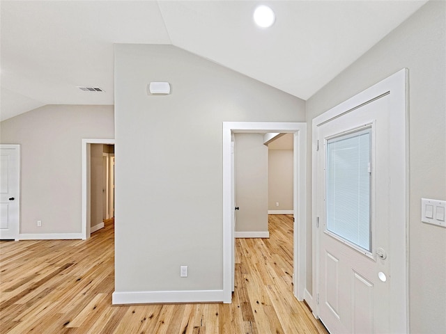 8622 Eden Valley Ln, Dallas, TX 75217 - entryway with vaulted ceiling, light wood-type flooring, and baseboards