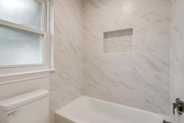 full bathroom featuring bathing tub / shower combination and toilet