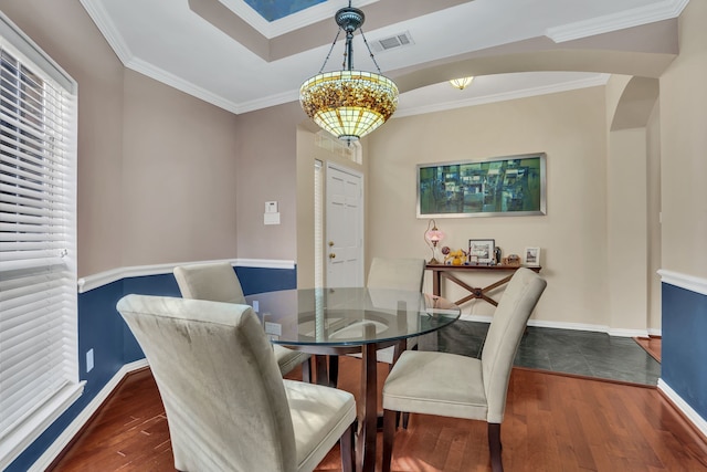 2630 Lakeforest Ct, Dallas, TX 75214 - dining space featuring wood-type flooring, ornamental molding, baseboards, and arched walkways