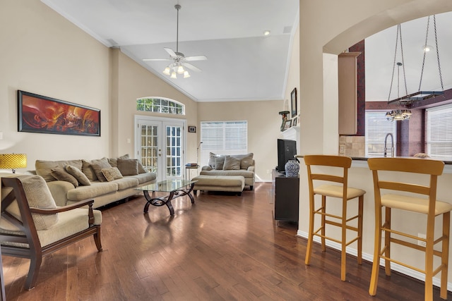 2630 Lakeforest Ct, Dallas, TX 75214 - living room with arched walkways, a ceiling fan, dark wood-style floors, high vaulted ceiling, and ornamental molding