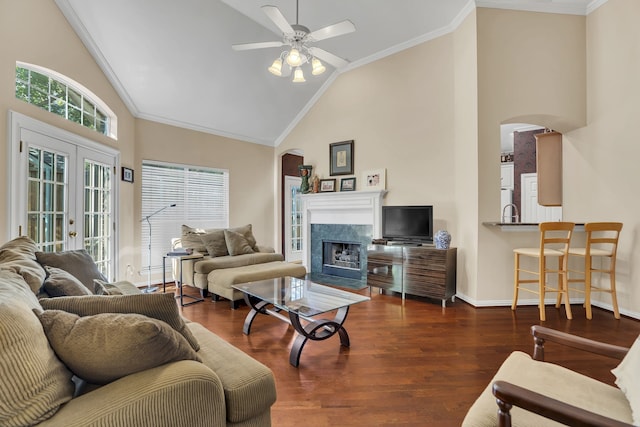 2630 Lakeforest Ct, Dallas, TX 75214 - living room with arched walkways, high vaulted ceiling, a ceiling fan, wood finished floors, and a high end fireplace