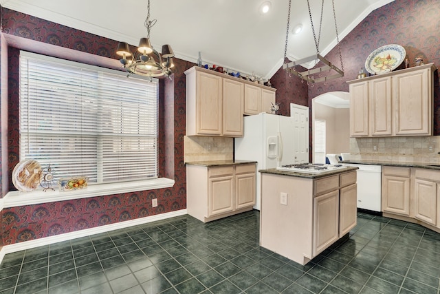 2630 Lakeforest Ct, Dallas, TX 75214 - kitchen with wallpapered walls, a chandelier, crown molding, arched walkways, and white appliances