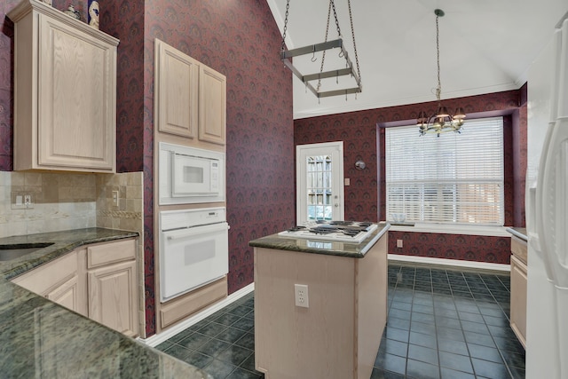 2630 Lakeforest Ct, Dallas, TX 75214 - kitchen with white appliances, dark tile patterned floors, a chandelier, a kitchen island, and light brown cabinetry