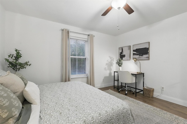 3244 Donnelly Cir Unit 1110, Fort Worth, TX 76107 - bedroom featuring baseboards, wood finished floors, and ceiling fan
