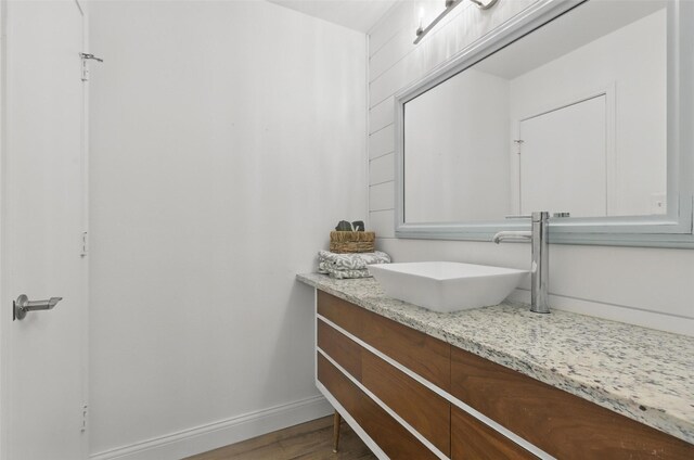 3244 Donnelly Cir Unit 1110, Fort Worth, TX 76107 - bathroom featuring vanity, wood finished floors, and baseboards
