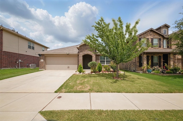 view of front of house with a front lawn, brick siding, central AC unit, concrete driveway, and an attached garage