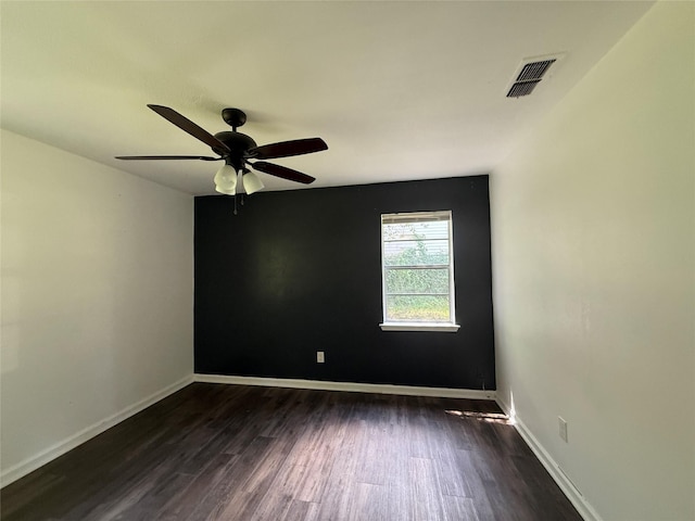 290 Dickard St, Hawkins, TX 75765 - unfurnished room featuring a ceiling fan, baseboards, visible vents, and dark wood finished floors