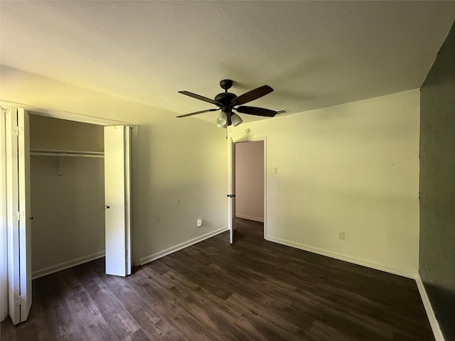 290 Dickard St, Hawkins, TX 75765 - unfurnished bedroom with baseboards, ceiling fan, a closet, and dark wood-type flooring
